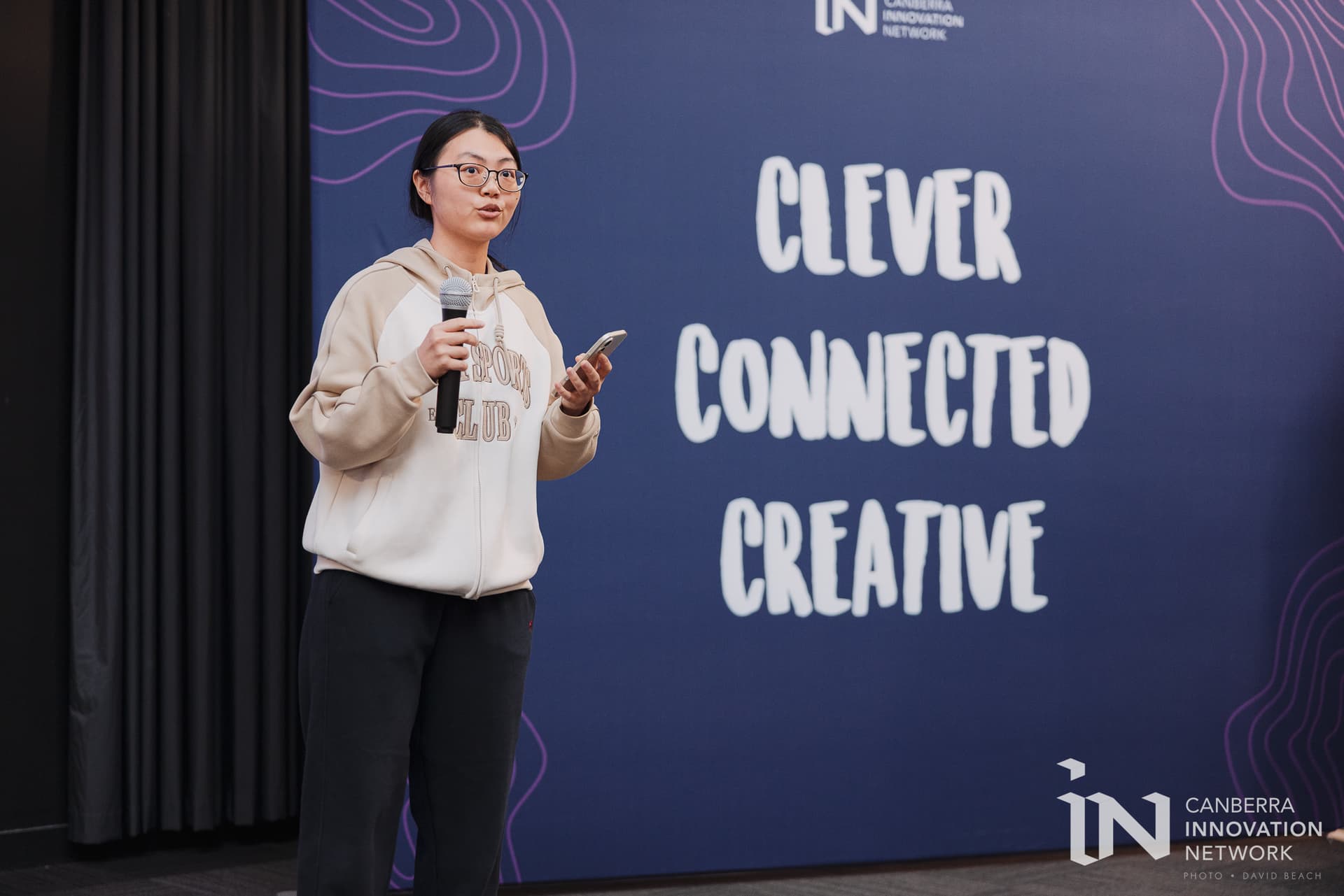 YEAF Co-founder, Yuting Su pitching the tea experience at First Wednesday Connect (September 2026, Academy of Interactive Education Canberra). Photo: David Beach.
