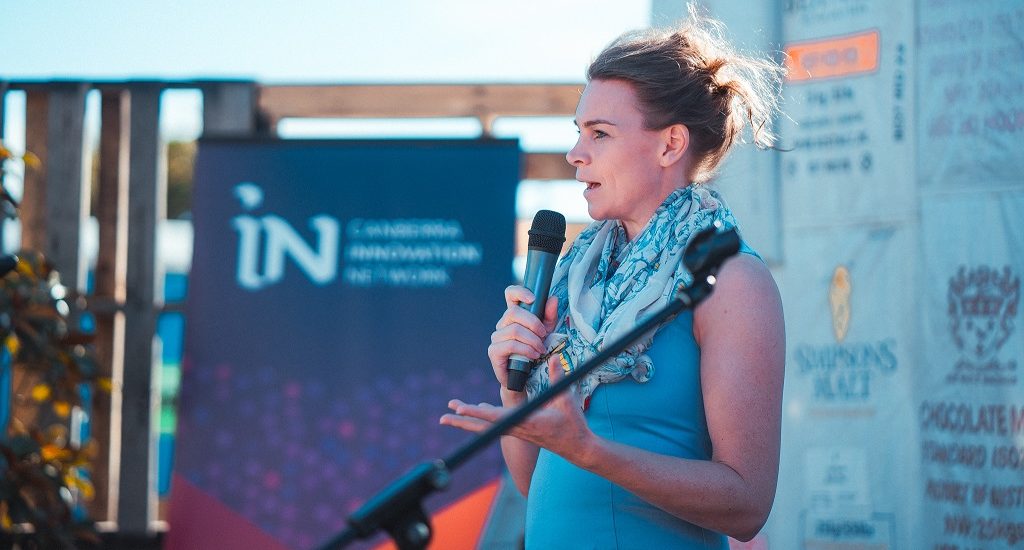 Woman pitching at event
